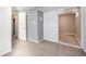 Neutral room with access to another room, carpeted floor and white door at 10555 Montview Blvd, Aurora, CO 80010