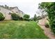 Extensive backyard space including manicured grass and mature trees at 1128 S Ventura Cir # K, Aurora, CO 80017