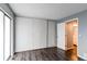 Bedroom boasts sleek hardwood floors, neutral walls, ample closet space, and a connected bathroom at 1128 S Ventura Cir # K, Aurora, CO 80017