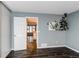 Bedroom offers hardwood floors, neutral walls, closet, and an open doorway to the rest of the home at 1128 S Ventura Cir # K, Aurora, CO 80017