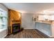 Comfortable living area with a fireplace, and an open layout to the kitchen at 1128 S Ventura Cir # K, Aurora, CO 80017