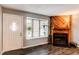 Bright living room with a door, and fireplace at 1128 S Ventura Cir # K, Aurora, CO 80017