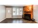 Cozy living room featuring a modern fireplace, large windows, and ample natural light at 1128 S Ventura Cir # K, Aurora, CO 80017