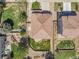 Aerial view of backyard with stone patio, seating area, and lush green space at 2354 Cactus Bloom Ct, Castle Rock, CO 80109