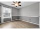 Well-lit bedroom boasting wood floors, chair-rail detail, and large window offering natural light at 2354 Cactus Bloom Ct, Castle Rock, CO 80109