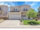 Charming two-story home featuring a spacious front porch and a well-manicured lawn with mature tree at 2354 Cactus Bloom Ct, Castle Rock, CO 80109