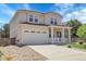 Two-story home with a two-car garage, front porch, and neutral-colored exterior with manicured lawn at 2354 Cactus Bloom Ct, Castle Rock, CO 80109