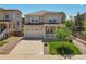 Charming two-story home with a spacious front porch, a well-manicured lawn, and a two-car garage at 2354 Cactus Bloom Ct, Castle Rock, CO 80109