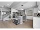 Modern kitchen featuring stainless steel appliances, a kitchen island with seating, and recessed lighting at 2354 Cactus Bloom Ct, Castle Rock, CO 80109