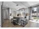 Bright kitchen with large island, granite countertops, modern lighting and stainless steel appliances at 2354 Cactus Bloom Ct, Castle Rock, CO 80109