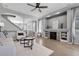 Bright living room with stone fireplace, hardwood floors, and an open floor plan at 2354 Cactus Bloom Ct, Castle Rock, CO 80109
