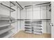 Organized walk-in closet with multiple shelves, hanging rods, and storage drawers at 2354 Cactus Bloom Ct, Castle Rock, CO 80109
