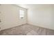 Bedroom featuring neutral carpeting, a bright window, and white trim at 1884 Sawtooth Mountain Dr, Berthoud, CO 80513
