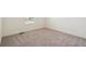 Neutral bedroom with gray carpeting, a bright window, and white trim at 1884 Sawtooth Mountain Dr, Berthoud, CO 80513