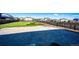 Large, fenced backyard with a paved patio area perfect for outdoor entertaining at 129 S Waterloo St, Aurora, CO 80018