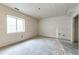 Unfinished basement space with a window, offering potential for customization and expansion at 129 S Waterloo St, Aurora, CO 80018
