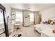Inviting bedroom with a vanity, dresser, and cozy bed, creating a relaxing space at 129 S Waterloo St, Aurora, CO 80018