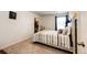 Comfortable bedroom with a bed and closet with personal touches at 129 S Waterloo St, Aurora, CO 80018