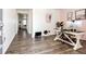 Inviting entryway featuring wood-look flooring and an open layout to the living spaces at 129 S Waterloo St, Aurora, CO 80018