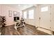 Entryway featuring wood-look flooring, and an open layout to the living spaces at 129 S Waterloo St, Aurora, CO 80018