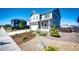 Lovely home with rock landscaping, front porch, and a two-car garage at 129 S Waterloo St, Aurora, CO 80018