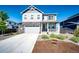 Attractive two story home with a well kept lawn and two-car garage at 129 S Waterloo St, Aurora, CO 80018