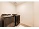 Modern laundry room with updated side-by-side washer and dryer units at 129 S Waterloo St, Aurora, CO 80018