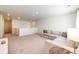 Neutral living room featuring plush carpet, sectional sofa, and plenty of space for relaxing at 129 S Waterloo St, Aurora, CO 80018