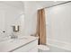 Bathroom with tile shower, updated vanity, and new fixtures at 470 Kiowa Ave, Bennett, CO 80102