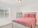 A cozy bedroom with natural light, neutral paint, and soft carpet at 470 Kiowa Ave, Bennett, CO 80102