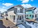 Two-story home boasts a cozy porch, modern siding, and meticulously landscaped surroundings, creating an inviting first impression at 470 Kiowa Ave, Bennett, CO 80102
