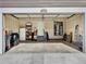 Spacious two-car garage with ample storage space and interior access door at 470 Kiowa Ave, Bennett, CO 80102