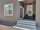 Covered patio featuring neutral siding and furniture, offering a cozy outdoor relaxation and entertainment area at 470 Kiowa Ave, Bennett, CO 80102