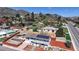 An aerial view featuring a multi-level home with solar panels, a landscaped yard, and scenic views of the neighborhood at 602 5Th St, Golden, CO 80403