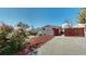 Home exterior with a spacious backyard, featuring a wooden fence and mountain views at 602 5Th St, Golden, CO 80403