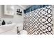 Contemporary bathroom featuring modern sink, toilet, and shower with patterned curtain at 602 5Th St, Golden, CO 80403