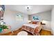 Cozy bedroom with hardwood floors and a comfortable bed at 602 5Th St, Golden, CO 80403