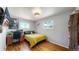 Bright bedroom with hardwood floors, a large window, and a desk at 602 5Th St, Golden, CO 80403