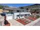 Charming two-story home with a balcony, a well-manicured yard, and a one car garage at 602 5Th St, Golden, CO 80403