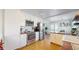 Well-lit kitchen with white cabinets, stainless steel appliances, and cork flooring at 602 5Th St, Golden, CO 80403