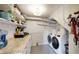 Clean laundry room with updated washer/dryer, storage shelves, and a countertop at 602 5Th St, Golden, CO 80403