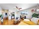 Inviting living room featuring hardwood floors, a ceiling fan, and large windows with mountain views at 602 5Th St, Golden, CO 80403
