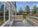 Cozy back deck with access to the yard and a view of the natural landscape beyond the fence at 3434 Fantasy Pl, Castle Rock, CO 80109