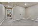 Unfurnished carpeted basement space with neutral walls, and view of bedroom at 3434 Fantasy Pl, Castle Rock, CO 80109