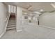 Spacious carpeted basement with stairs leading to upper level and neutral color palette at 3434 Fantasy Pl, Castle Rock, CO 80109