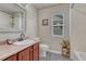 Functional bathroom with a single sink vanity, toilet, and shower/tub combination with tile surround at 3434 Fantasy Pl, Castle Rock, CO 80109