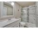 Bathroom featuring white vanity, toilet, and modern glass enclosed shower with marble accents at 3434 Fantasy Pl, Castle Rock, CO 80109