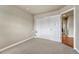 Small, carpeted bedroom with a closet, view of the hallway, and adequate space for a bed and small furnishings at 3434 Fantasy Pl, Castle Rock, CO 80109