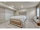 Basement bedroom featuring a large bed, mirrored furniture, and sliding door closet at 3434 Fantasy Pl, Castle Rock, CO 80109