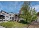Charming two-story brick home with a well-manicured lawn and mature landscaping at 3434 Fantasy Pl, Castle Rock, CO 80109